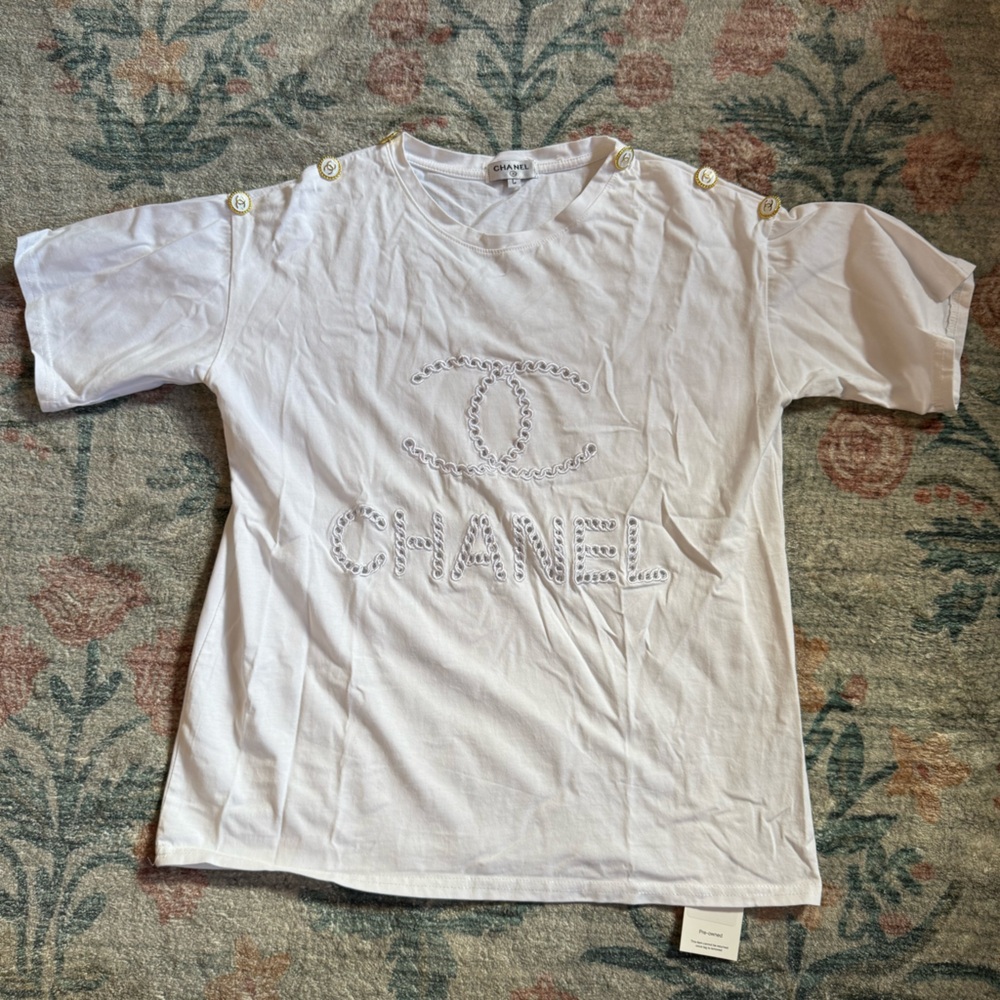 Chanel White T-Shirt with Gold Emblem buttons